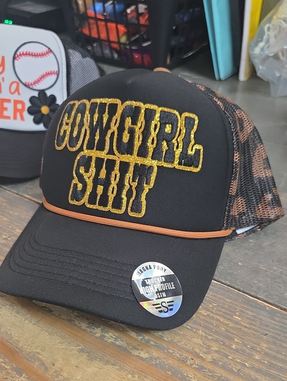 Black 'Cowgirl Shit' Trucker Hat with Gold Embroidered Lettering